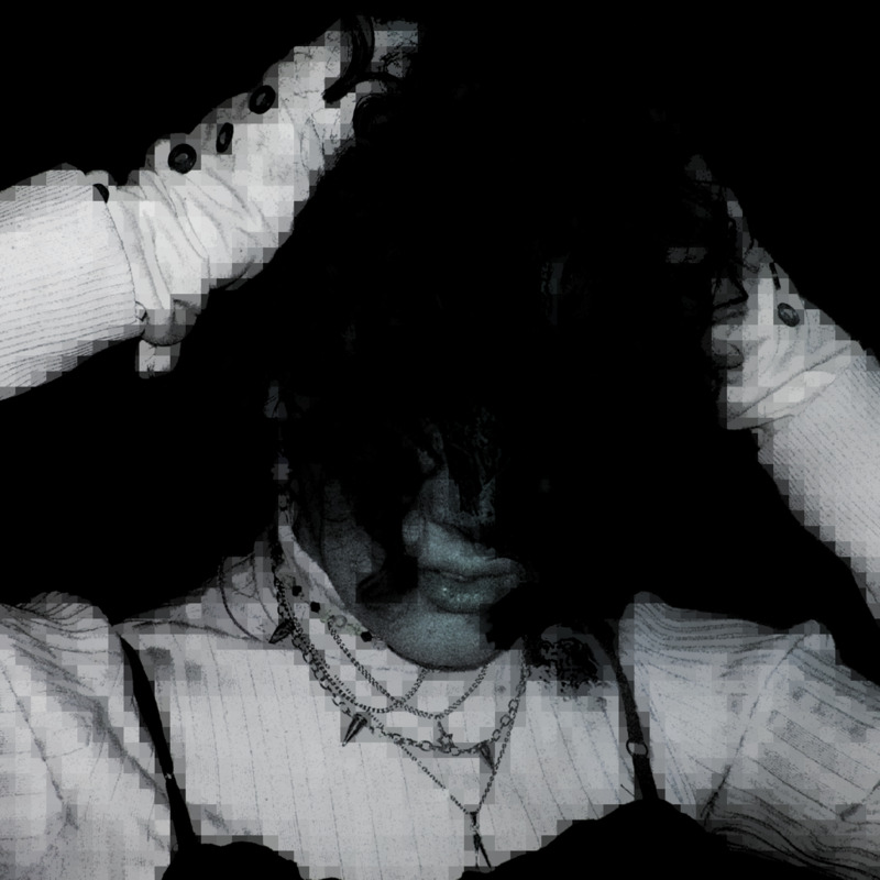An image of nnwhen; their face obscured with paints